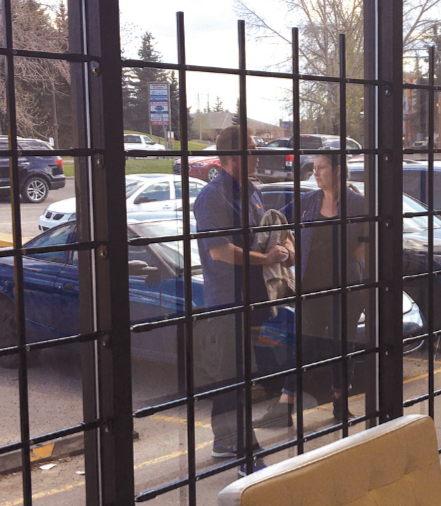 Commercial window bar panel shown fixed to storefront windows